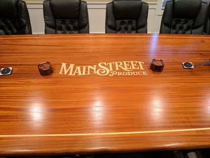 Custom Sapele conference table by Specialty Woods-Inlaid Logo