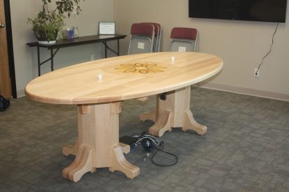 Solid maple oval conference table with company inlaid logo. Specialty Woods Solid Wood Conference Table.