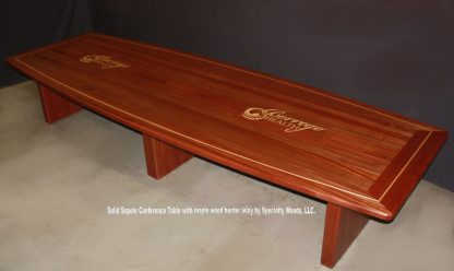 Solid Sapele conference room table with inlaid logo. Conference table with outlets. 15 feet long Sapele Solid wood conference table.