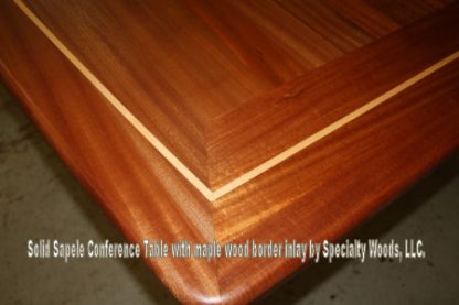 Sapele 15 feet long Conference table with maple border inlay built by Specialty Woods
