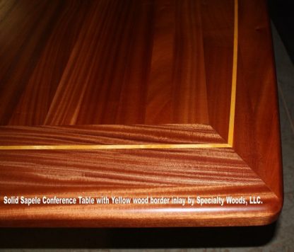 Solid Sapele hardwood conference room table with yellow wood border inlay by Specialty Woods, LLC.